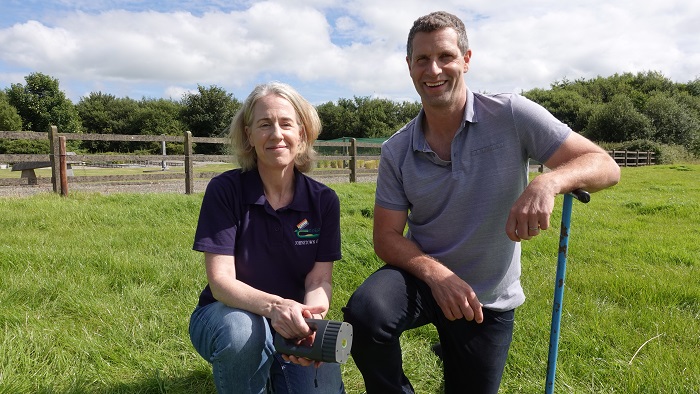 Karen Daly pictured in a field with Jonathan McCrea