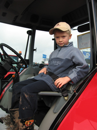 Child on tractor with seat belt