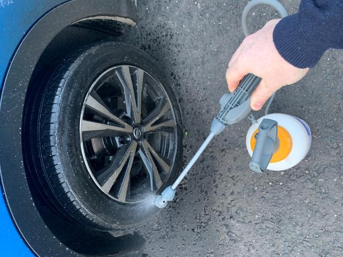 Disinfecting vehicle wheels upon entry