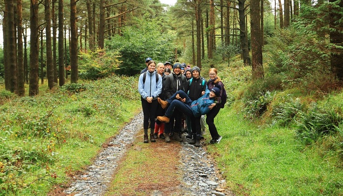 Equitation students pictured in a wood
