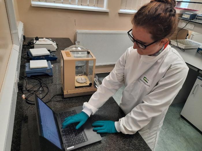 Grace weighing oven dry wooden cores at Teagasc laboratory.