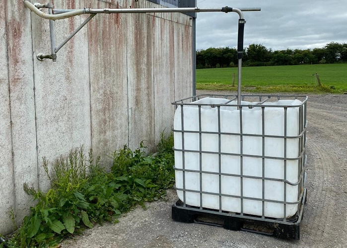 IBC tank on david gannons farm with pipe leading from parlour