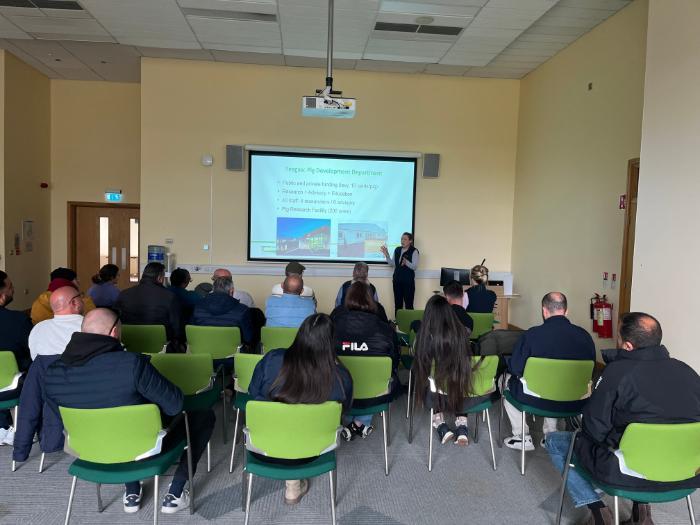 participants and presenter at a pig welfare lecture