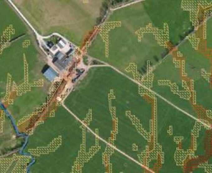 Image showing a farm yard on a slope and the flow of water through it