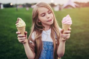 Child with two ice cream cones