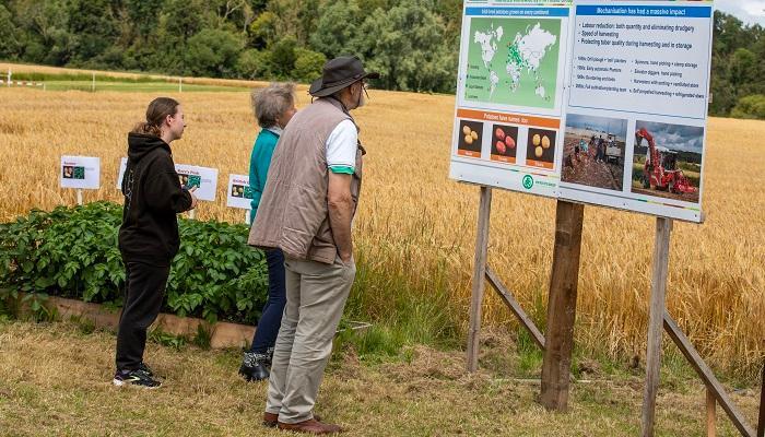 Oak Park 60th attendees viewing boards