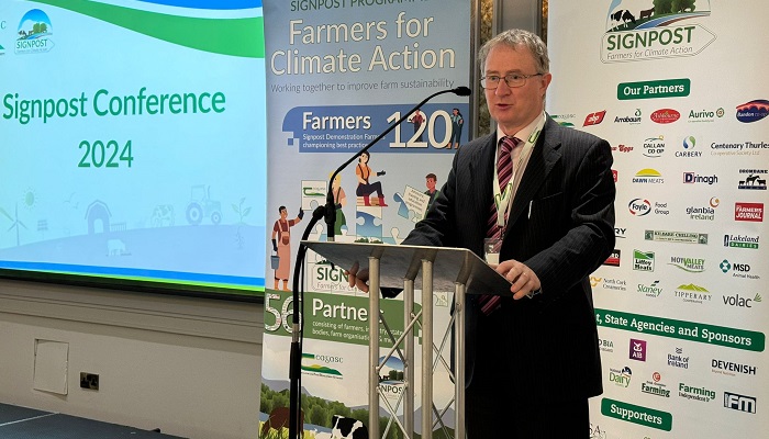 Professor Frank O Mara speaking from the podium at the Signpost Conference