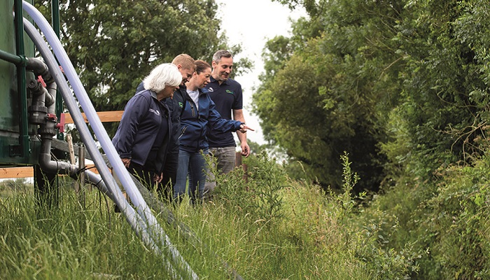 Michele McCormack, Mark Boland, Bridget Lynch and Ognjen Zurovec standing at the stream side at the catchment outlet in Ballycanew