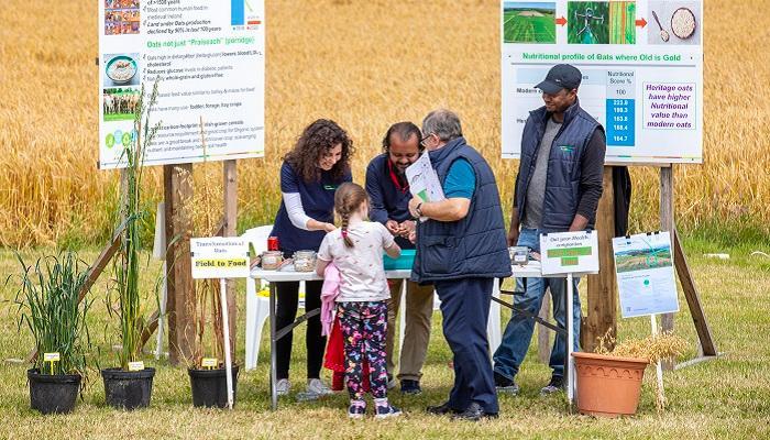oak park 60th attendees speaking with researchers