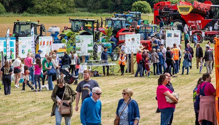 oak park 60th crowds viewing farm machinery and information boards