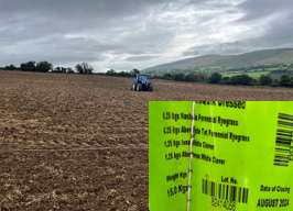 reseeding and fertiliser spread machine in field