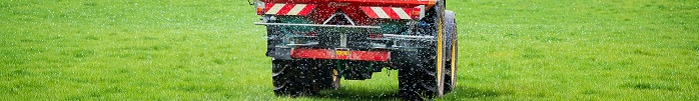 Close up of fertiliser spreader working
