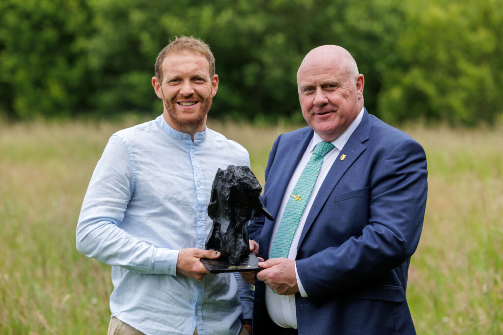 Minister Noel Grealish TD. is pictured presenting the award to Liam Rochford