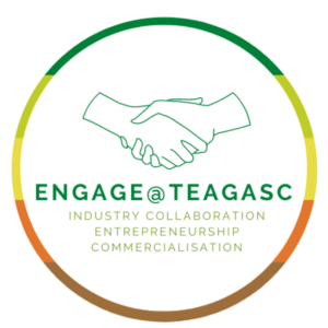 A circular logo. The circular outline is made up of five different colours, From top to bottom; Dark green, lime green, yellow, orange and light brown. Inside the circular outline, is a handshake. Underneath the handshake there is text 'Engage @ Teagasc', followed underneath by 'Industry Collaboration, Entrepreneurship, commercialisation'.