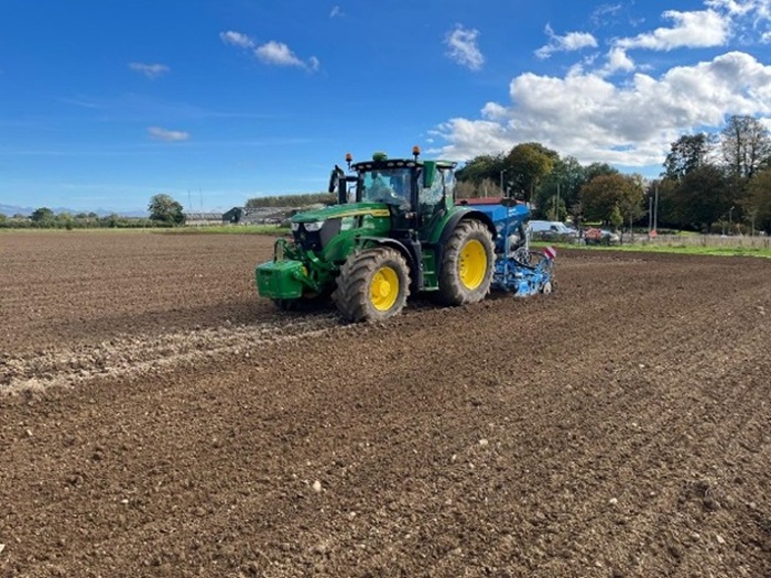A John Deere tractor and drill sowing winter barley at Kildalton College