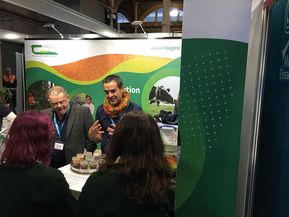 Teagasc’s Luis Lopez-Sangil (right) chats to visitors at the BT Young Scientist & Technology Exhibition 2023