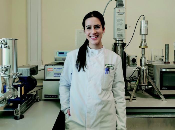 A scientist standing in a lab