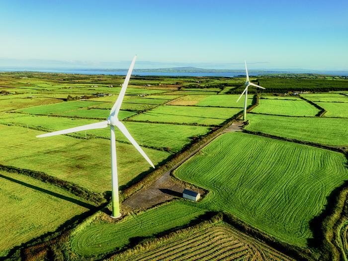 Green fields with wind turbines