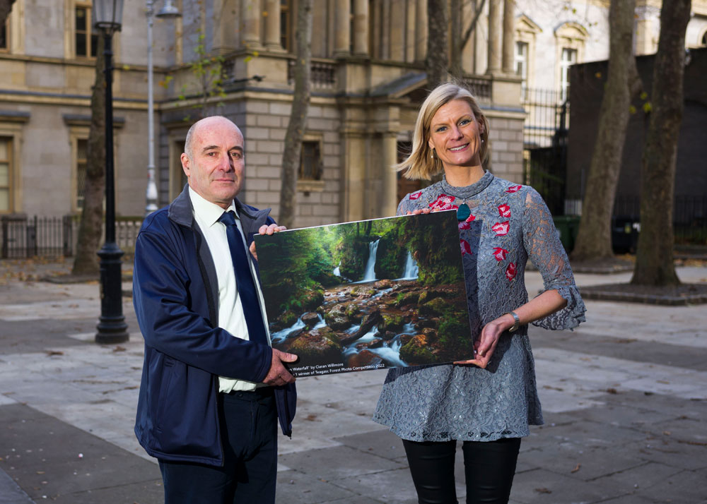 Minister Pippa Hackett with Teagasc Forestry Liaison Officer Paul Butler announcing the overall forest photo competition winner 2022