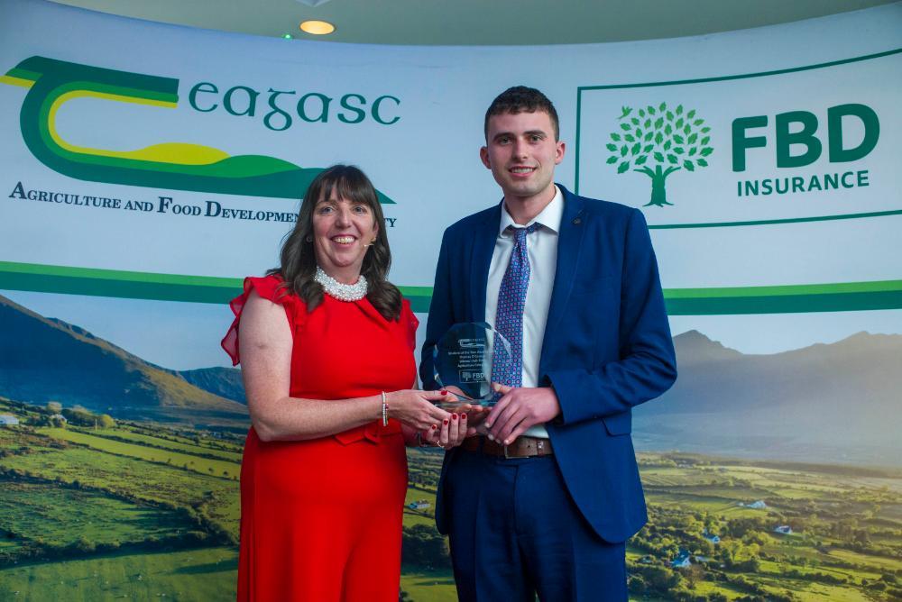 Thomas is pictured receiving his award from Dr Anne-Marie Butler, Teagasc Head of Education