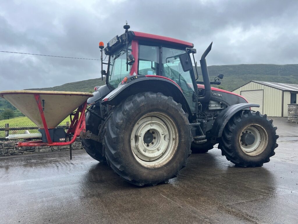 Tractor with fertiliser spreader attached
