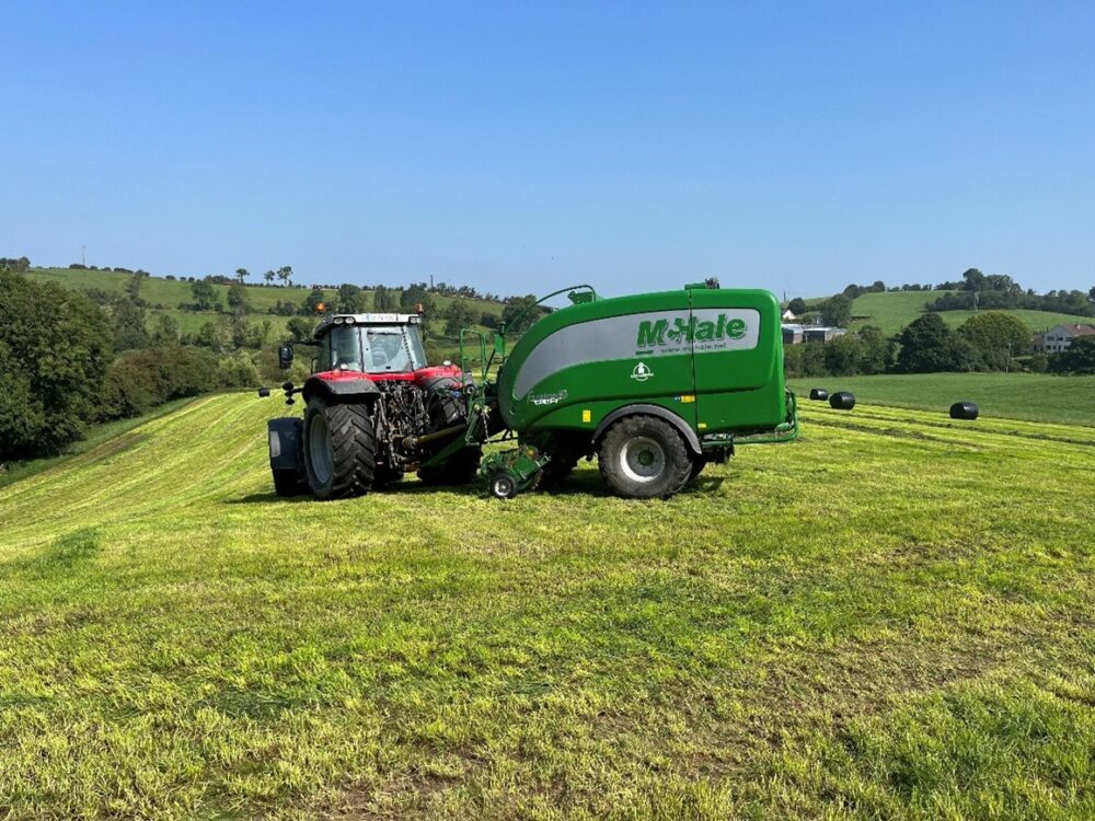 Silage being baled and wrapped from a surplus paddock