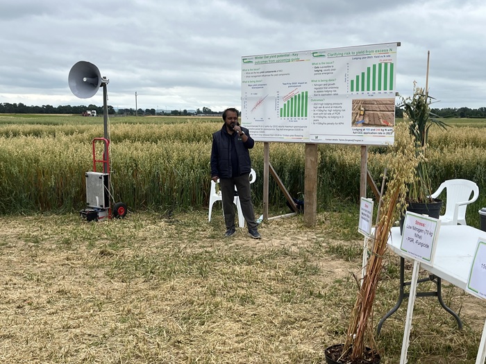 Dr Atikur Rahman speaking in from of a crop of winter oat