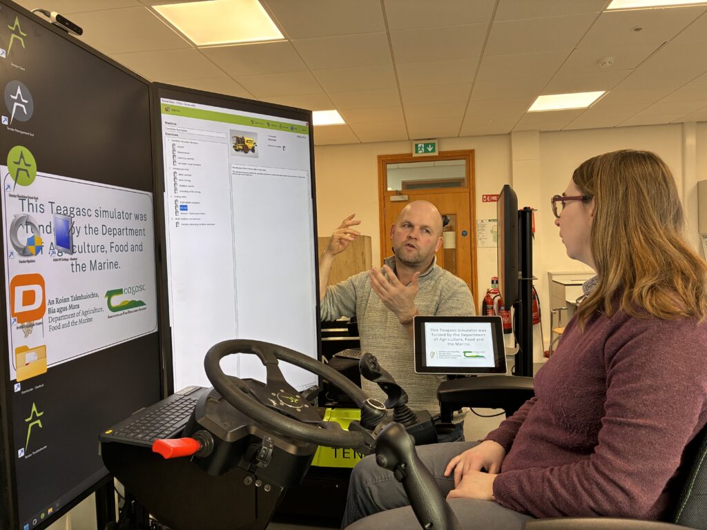 Professor Florence Becot,US farm safety expert pictured seated on one of the DAFM - funded machinery simulators