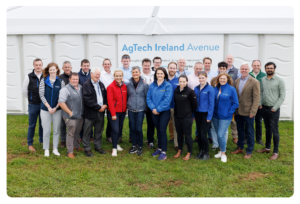 A group of people collectively standing in rows for a group picture