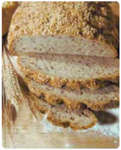 half sliced bread laying on floured board