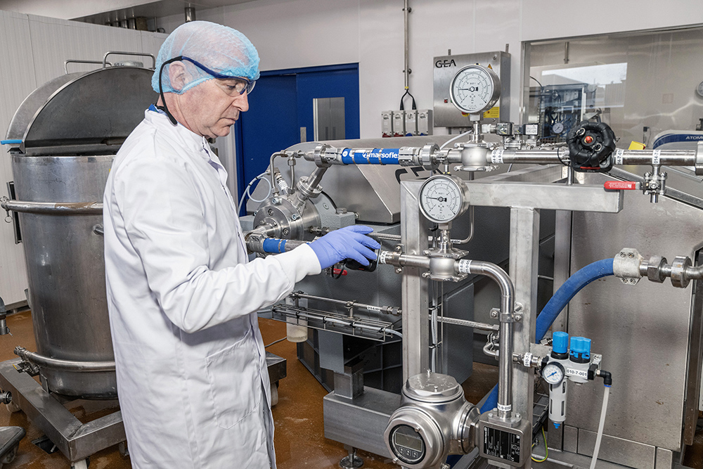 A scientist working on equipment in the lab