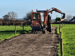 Tom O’Connell taking the opportunity to remove sods from the edge of the farm roadways
