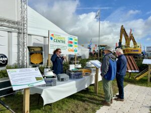 A Teagasc staff member speaking to attendees at the Climate Centre stand at Ploughing 25